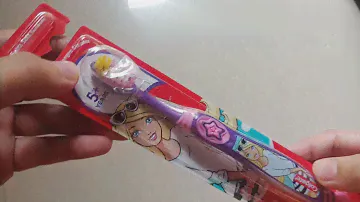 unboxing Colgate Barbie doll toothbrush